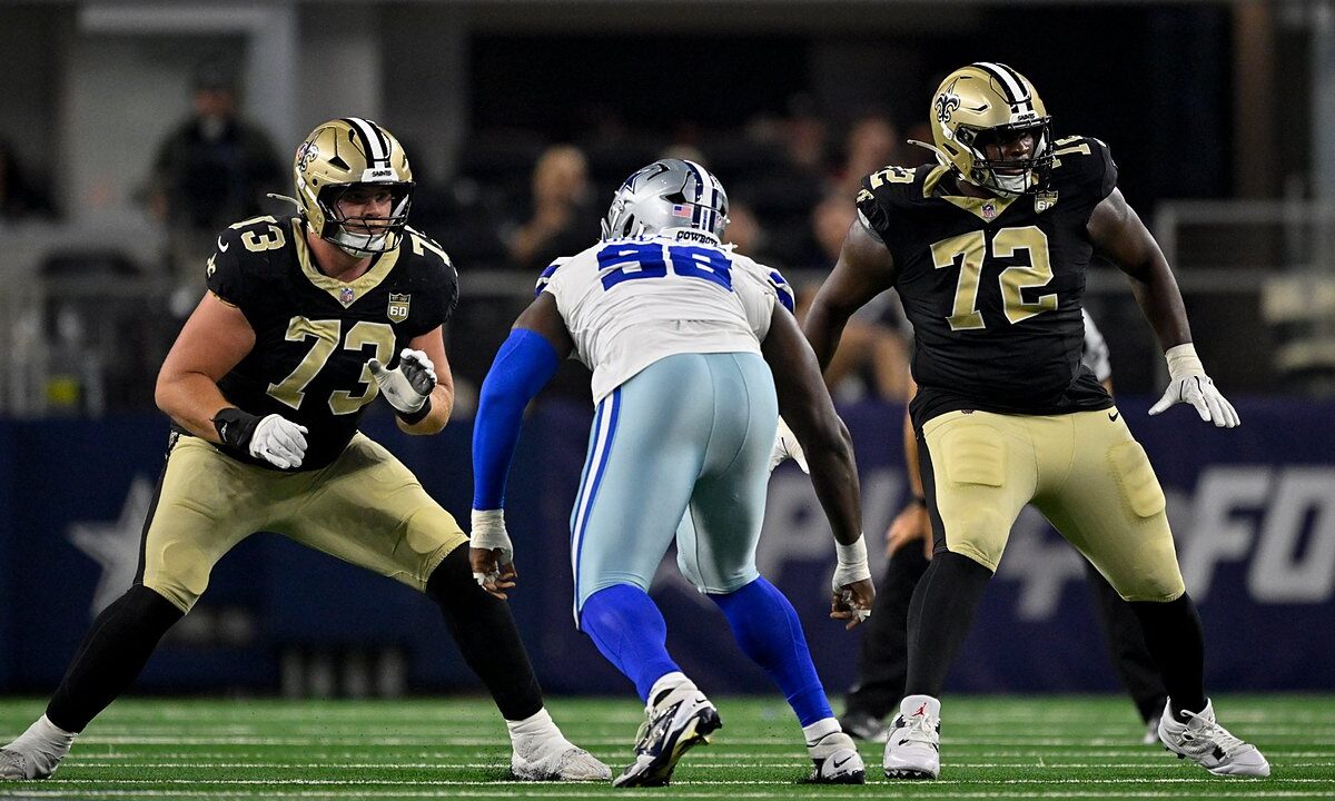 Dallas Cowboys defensive tackle Jonathan Bullard squares up between two New Orleans Saints offensive tackles in pass protection.