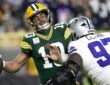 Dallas Cowboys defensive tackle Kenny Clark hits Green Bay Packers quarterback Jordan Love as he tries to throw.