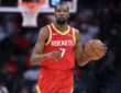 Houston Rockets forward Kevin Durant dribbles the ball with his left hand while bringing it up the court.