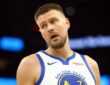 Golden State Warriors center Kristaps Porzingis on the court against the Phoenix Suns during the 2026 NBA play-in tournament at Mortgage Matchup Center in Phoenix.