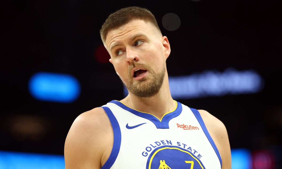 Golden State Warriors center Kristaps Porzingis on the court against the Phoenix Suns during the 2026 NBA play-in tournament at Mortgage Matchup Center in Phoenix.