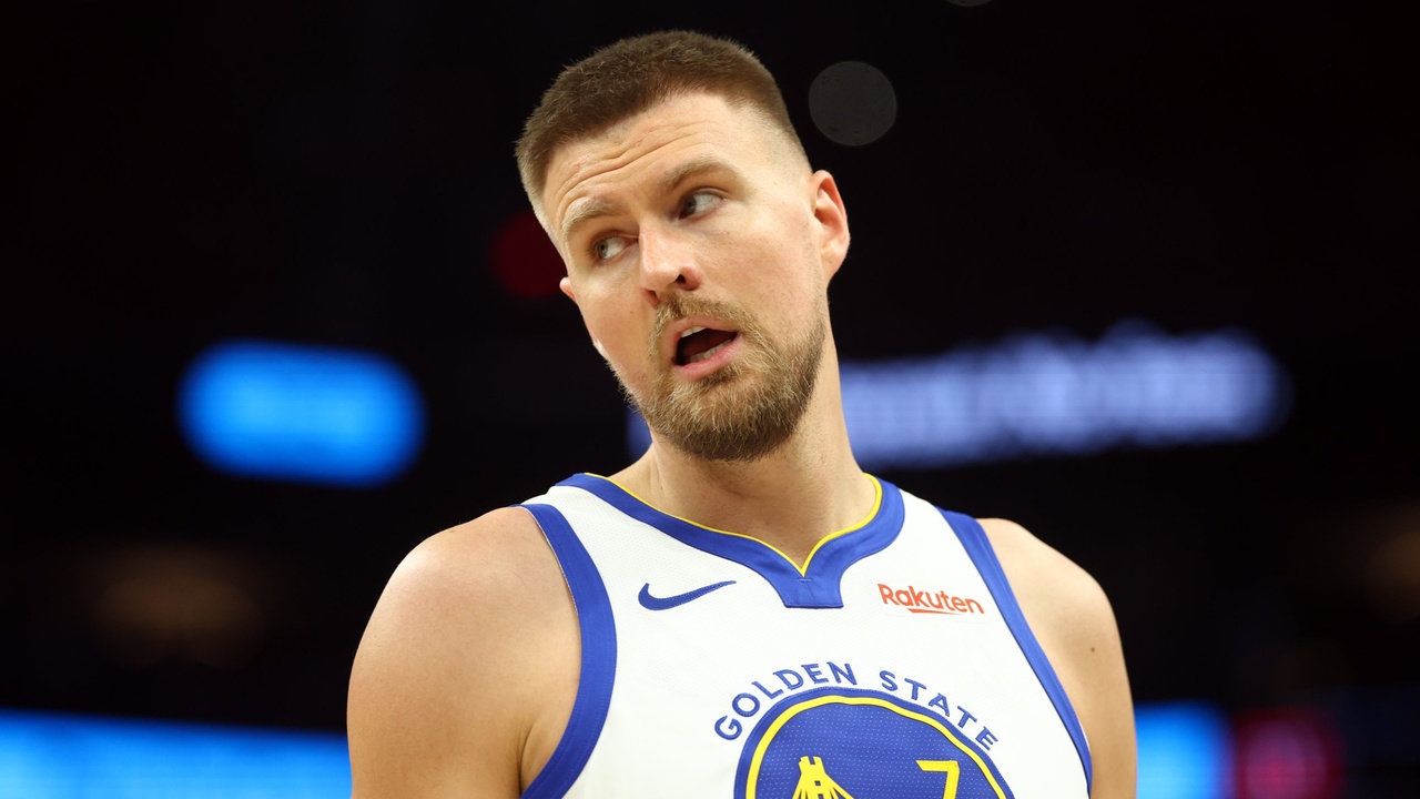 Golden State Warriors center Kristaps Porzingis on the court against the Phoenix Suns during the 2026 NBA play-in tournament at Mortgage Matchup Center in Phoenix.