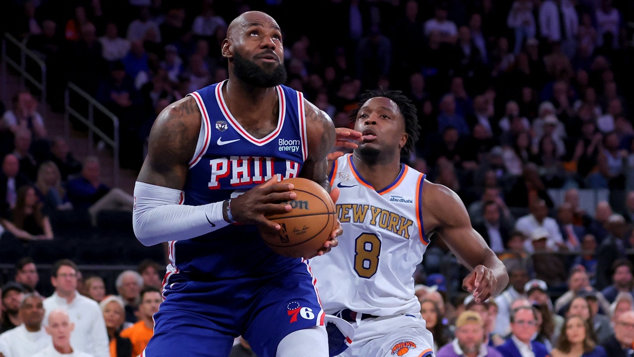 Philadelphia 76ers forward LeBron James #23 looks to shoot against New York Knicks forward OG Anunoby #8 at Madison Square Garden.
