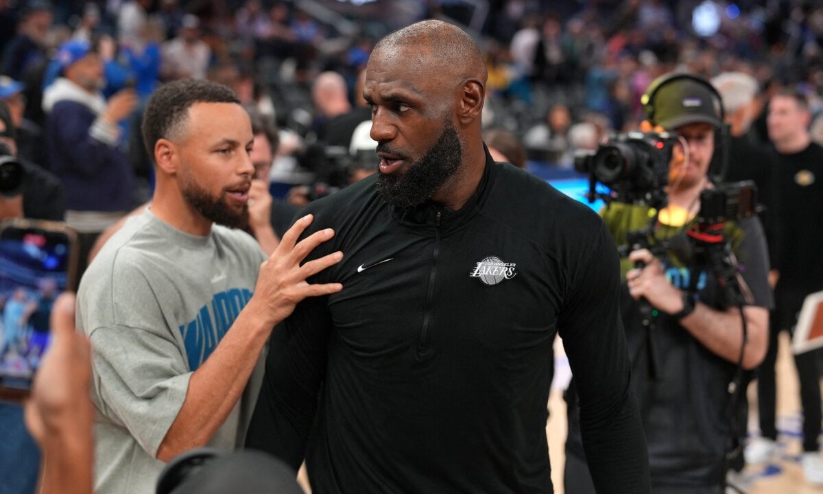 Los Angeles Lakers forward LeBron James #23 meets with Golden State Warriors guard Stephen Curry #30 after a game at Chase Center.