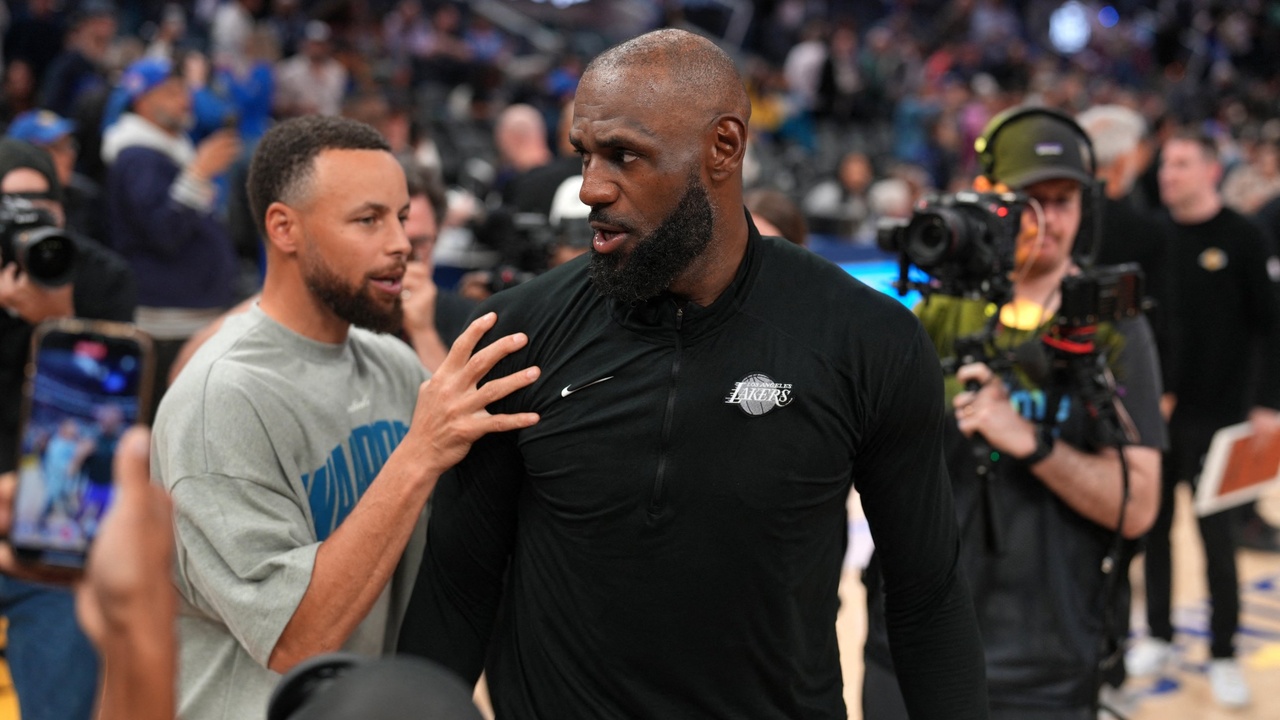 Los Angeles Lakers forward LeBron James #23 meets with Golden State Warriors guard Stephen Curry #30 after a game at Chase Center.