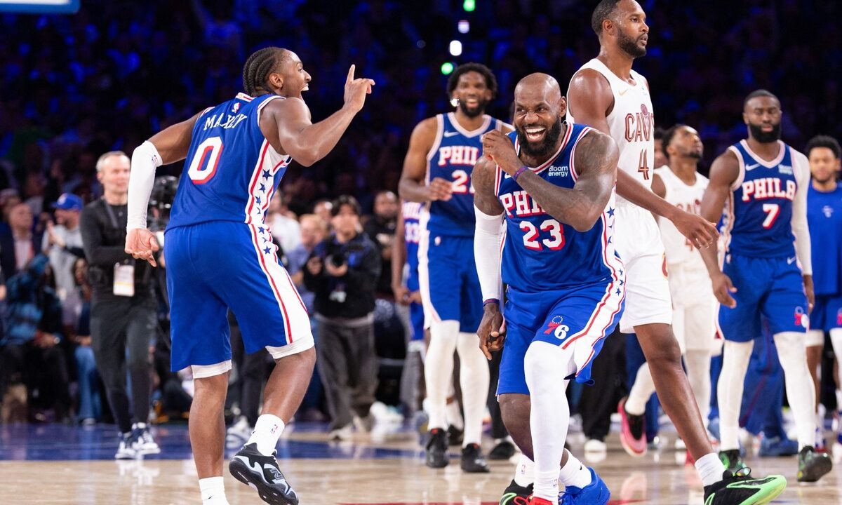 Philadelphia 76ers forward LeBron James #23 and guard Tyrese Maxey celebrate after a fourth-quarter score against the Cleveland Cavaliers at Xfinity Mobile Arena.