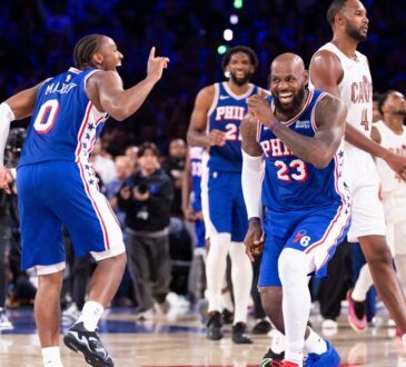 Philadelphia 76ers forward LeBron James #23 and guard Tyrese Maxey celebrate after a fourth-quarter score against the Cleveland Cavaliers at Xfinity Mobile Arena.