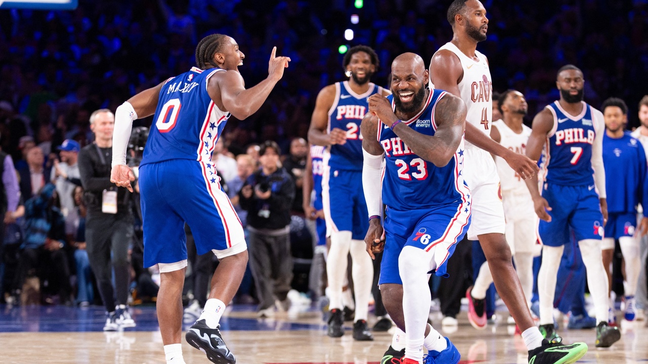 Philadelphia 76ers forward LeBron James #23 and guard Tyrese Maxey celebrate after a fourth-quarter score against the Cleveland Cavaliers at Xfinity Mobile Arena.