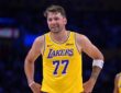 Los Angeles Lakers guard Luka Dončić #77 smiles at the free throw line against the Sacramento Kings at Crypto.com Arena.