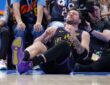 Los Angeles Lakers guard Luka Doncic #77 falls to the court during a play against the Oklahoma City Thunder at Paycom Center.
