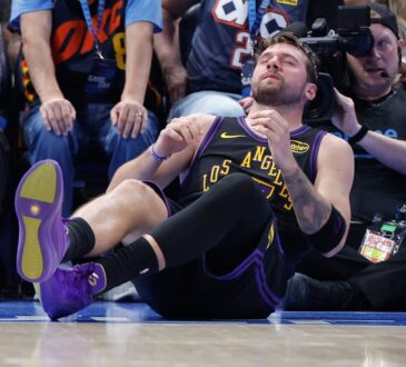 Los Angeles Lakers guard Luka Doncic #77 falls to the court during a play against the Oklahoma City Thunder at Paycom Center.