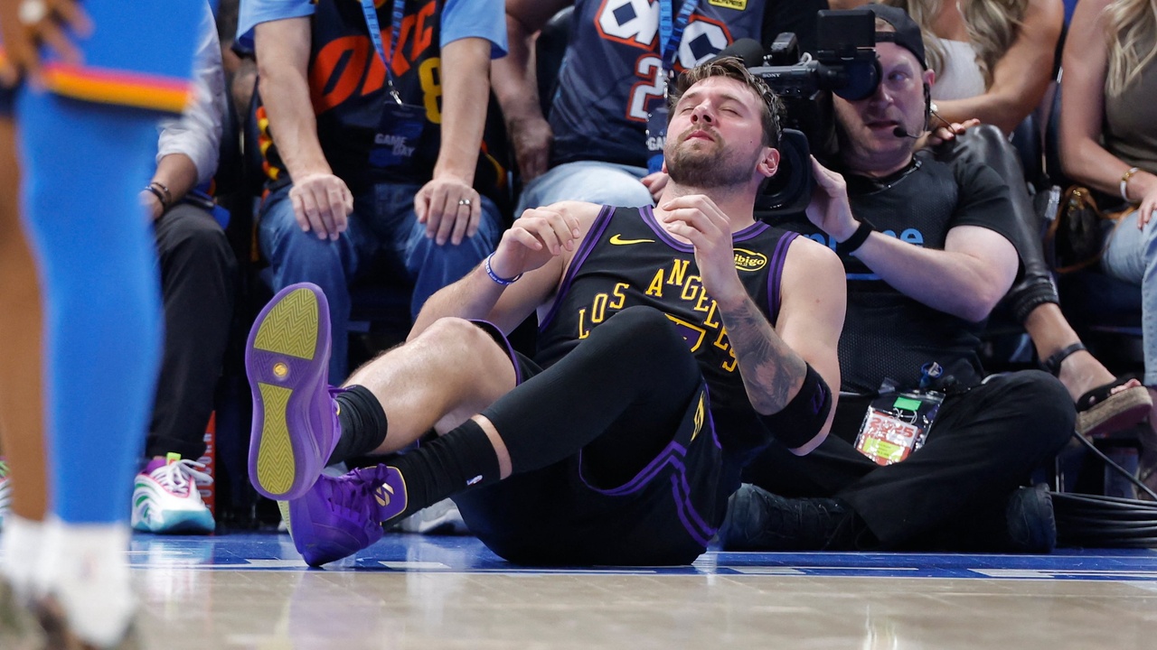Los Angeles Lakers guard Luka Doncic #77 falls to the court during a play against the Oklahoma City Thunder at Paycom Center.