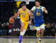 Los Angeles Lakers guard Luka Doncic #77 drives to the basket against Golden State Warriors forward Yaxel Lendeborg #1 at Crypto.com Arena.