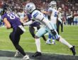 Baltimore Ravens tight end Matthew Hibner secures a touchdown catch as Dallas Cowboys cornerback Caelen Carson reaches for him.