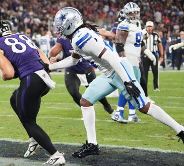 Baltimore Ravens tight end Matthew Hibner secures a touchdown catch as Dallas Cowboys cornerback Caelen Carson reaches for him.