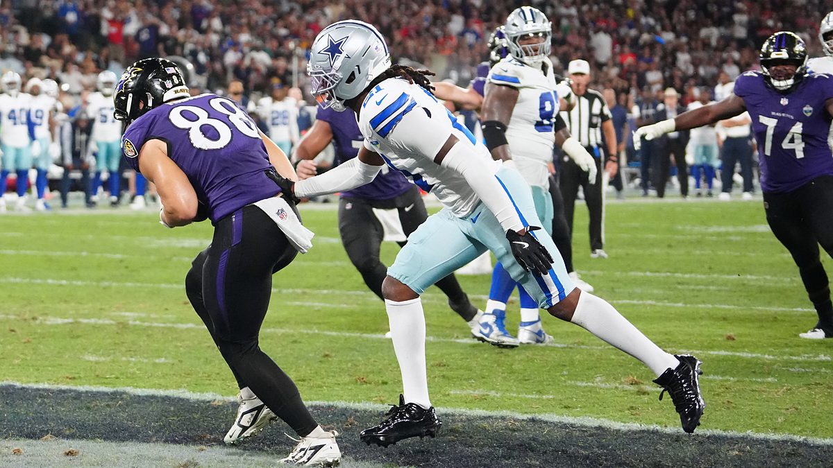 Baltimore Ravens tight end Matthew Hibner secures a touchdown catch as Dallas Cowboys cornerback Caelen Carson reaches for him.