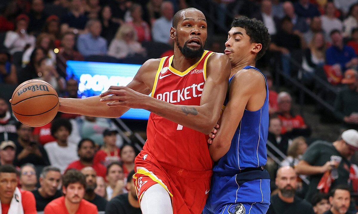 Houston Rockets forward Kevin Durant drives with the ball in his right hand as Dallas Mavericks guard Max Christie defends him.