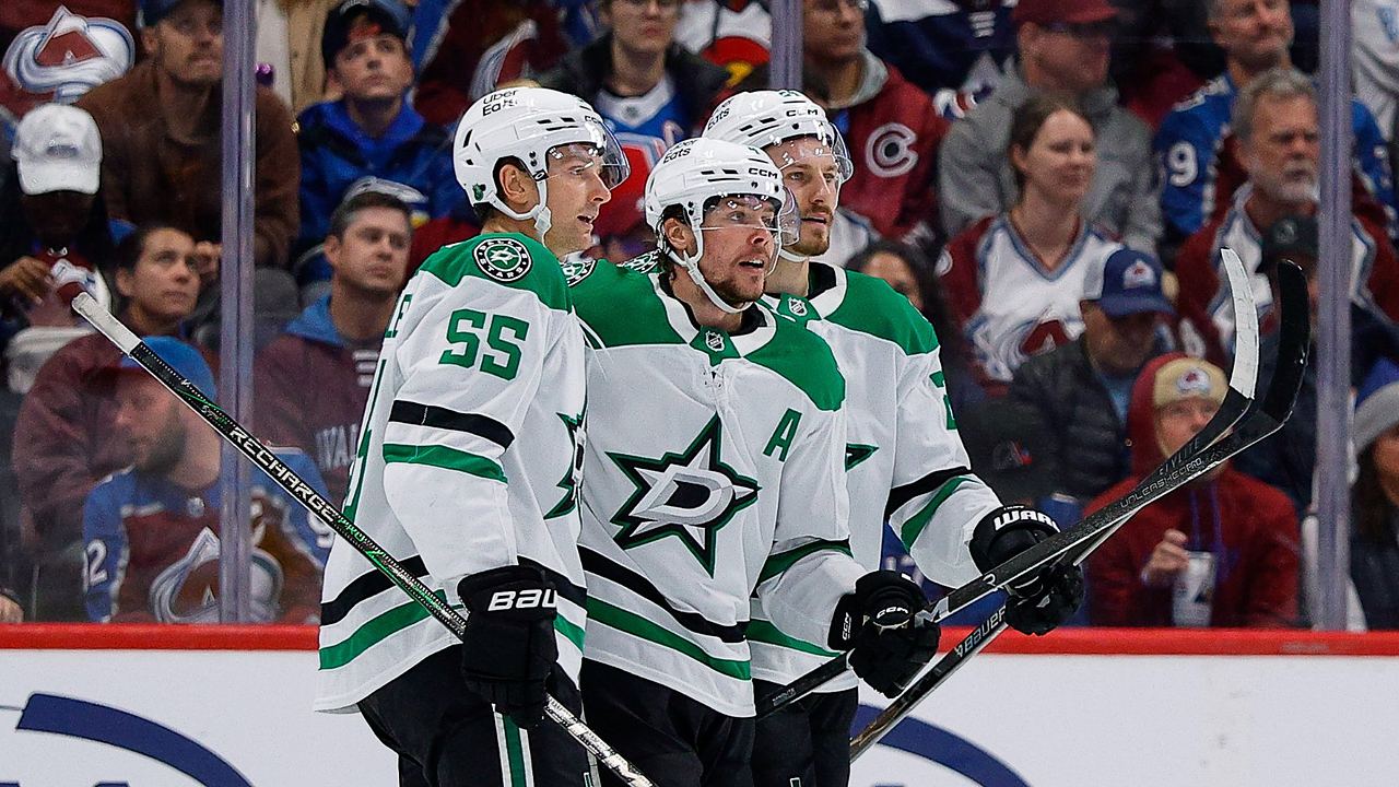 Dallas Stars defenseman Miro Heiskanen celebrates a goal with defenseman Thomas Harley and center Roope Hintz along the boards.
