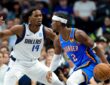 Mavericks forward Morez Johnson Jr. guards Thunder guard Shai Gilgeous-Alexander as he dribbles.