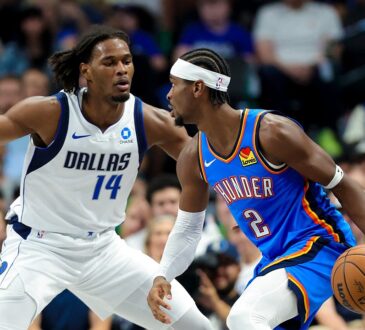 Mavericks forward Morez Johnson Jr. guards Thunder guard Shai Gilgeous-Alexander as he dribbles.