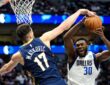 Dallas Mavericks center Moussa Cisse goes up with the ball as New Orleans Pelicans forward Karlo Matković reaches to block it.