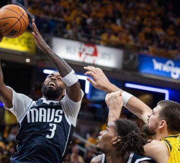 Mavericks forward Naji Marshall rises for a shot as Pacers center Ivica Zubac reaches to defend.