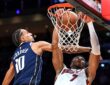 Miami Heat forward Giannis Antetokounmpo (7) dunks against Dallas Mavericks forward Zaccharie Risacher (10) during the first quarter at Kaseya Center on Oct. 26, 2026.