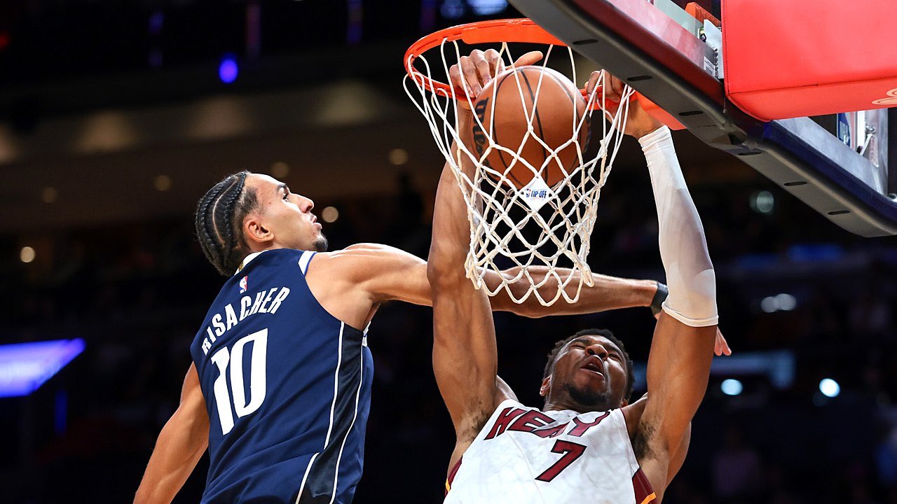 Miami Heat forward Giannis Antetokounmpo (7) dunks against Dallas Mavericks forward Zaccharie Risacher (10) during the first quarter at Kaseya Center on Oct. 26, 2026.