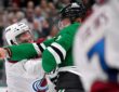 Stars center Roope Hintz throws a punch as Avalanche center Nathan MacKinnon ducks his head during a fight.