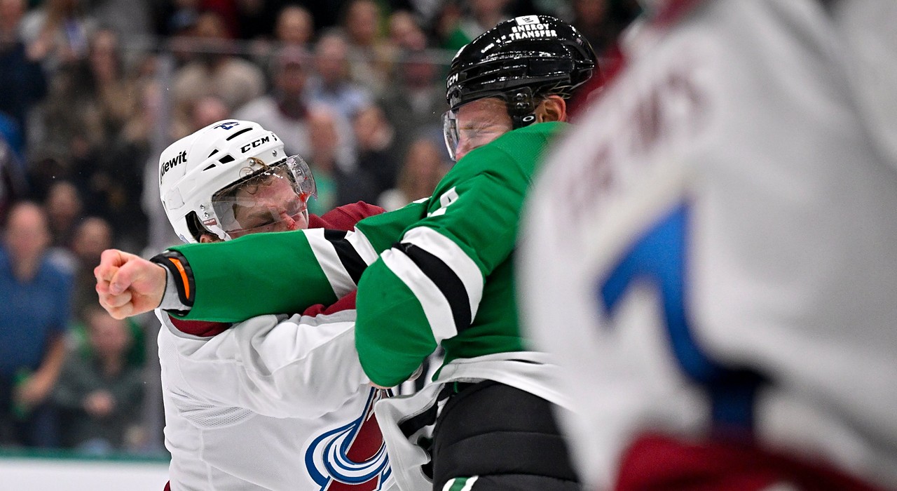 Stars center Roope Hintz throws a punch as Avalanche center Nathan MacKinnon ducks his head during a fight.