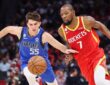 Mavericks forward Sergio de Larrea chases a loose ball alongside Rockets forward Kevin Durant.