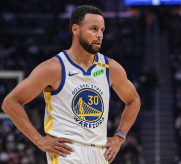 Golden State Warriors guard Stephen Curry #30 looks on during first-half action against the Sacramento Kings at Chase Center.