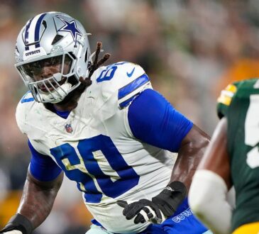 Dallas Cowboys offensive tackle Tyler Guyton slides into pass protection as a Green Bay Packers defender rushes in.