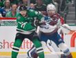 Stars center Tyler Seguin fights for position against Avalanche defenseman Brett Kulak in front of the Colorado net.