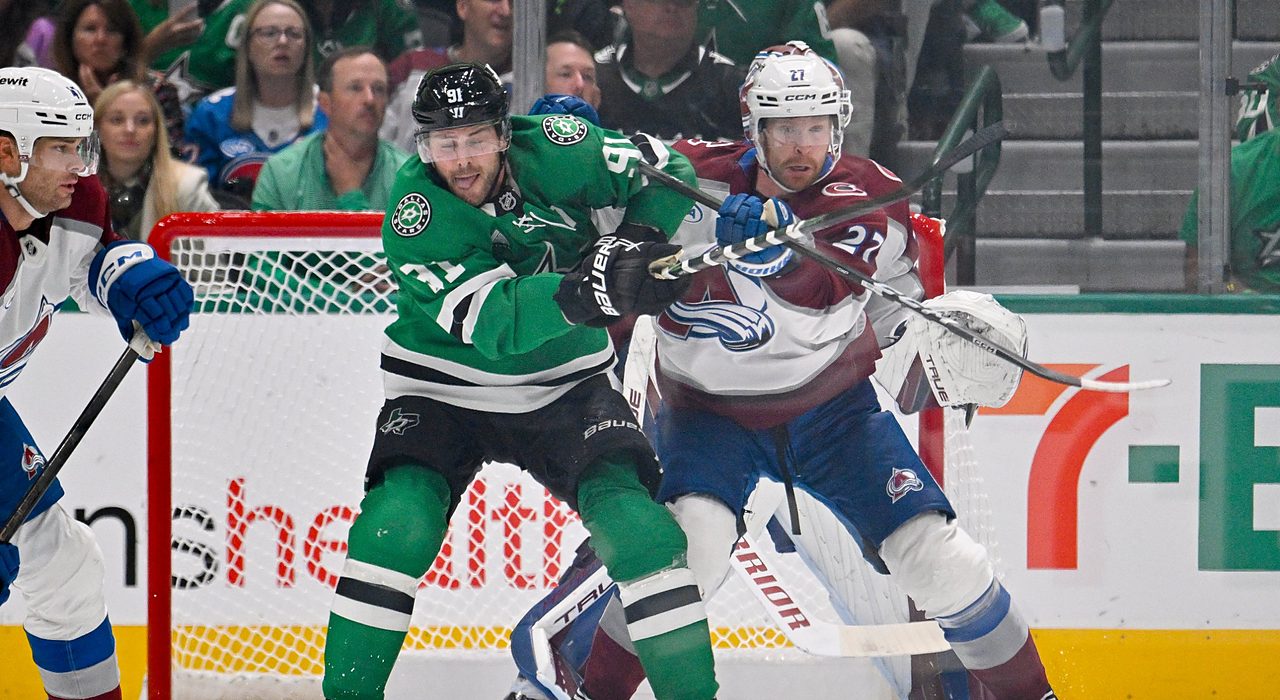 Stars center Tyler Seguin fights for position against Avalanche defenseman Brett Kulak in front of the Colorado net.