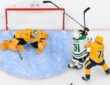 Stars center Tyler Seguin fights for position with Predators defenseman Brady Skjei beside the crease in an overhead view.