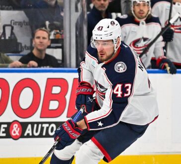 Blue Jackets right wing Valeri Nichushkin skates with the puck along the boards.