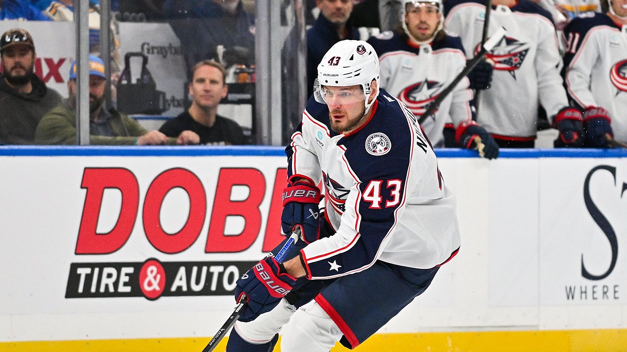 Blue Jackets right wing Valeri Nichushkin skates with the puck along the boards.