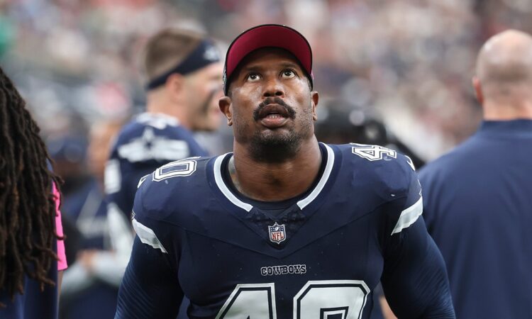 Cowboys outside linebacker Von Miller looks up from the sideline.