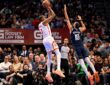 Mavericks forward Zaccharie Risacher leaps to contest a jump shot by Rockets forward Kevin Durant.
