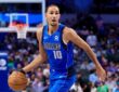 Dallas Mavericks forward Zaccharie Risacher dribbles up the court with his left hand in a blue Dallas No. 10 jersey.